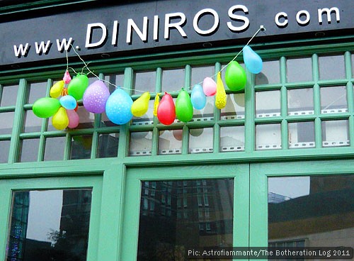 Deflated balloons on restaurant shopfront