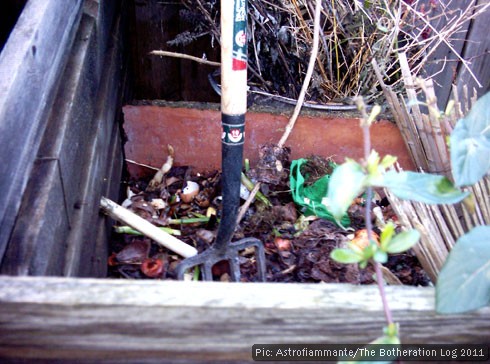 Compost heap with garden fork