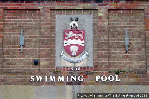 Municipal crest, dated 1938, with words 'Swimming Pool' beneath