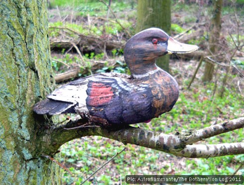 Red, purple and white wooden decoy duck