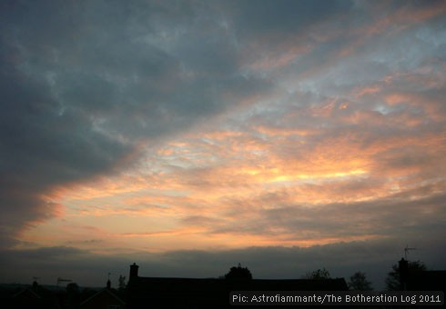 Blue, orange and grey sunset with clouds