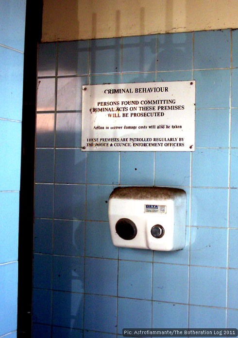 Notice warning against 'criminal behaviour' in derelict public convenience