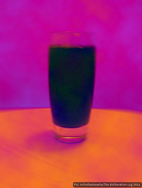 Dark-blue glass against purple wall