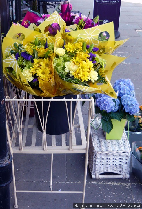 Wrapped bouquets outside a florist's shop