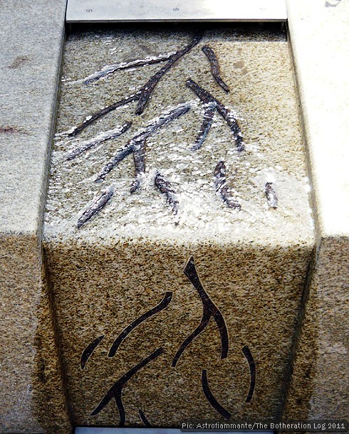 Town-centre water feature made from granite and featuring a branching pattern