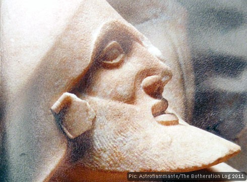 Image of a Greek sculpted head with helmet and beard