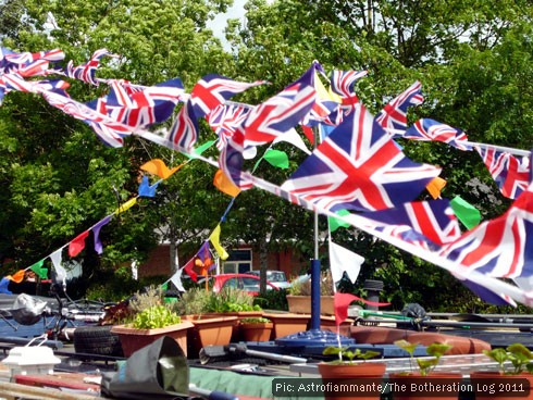 Bunting and potted plants on narrowboat rooves