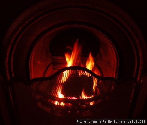 An open fire burning in a grate