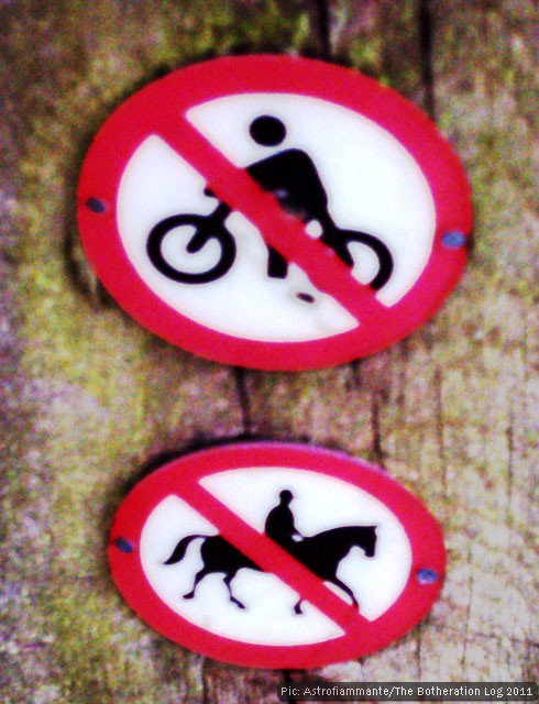 No cycling, no riding symbols on a footpath waymark post