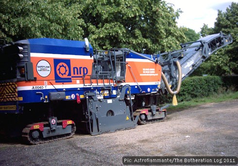 Road maintenance machinery stored in a car park