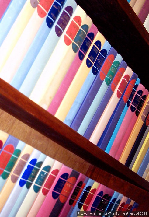 A row of books on a bookshelf A row of books on a bookshelf