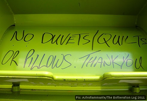 Instructions for users hand-written on the chute of a recycling skip