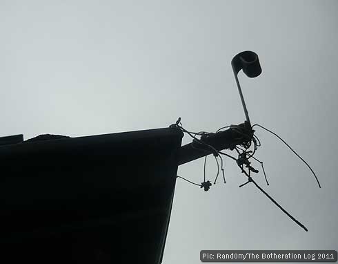 Hip iron silhouetted against roof ridge