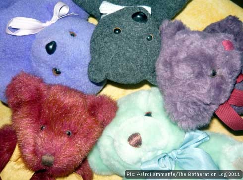 The heads of five teddy bears of various colours