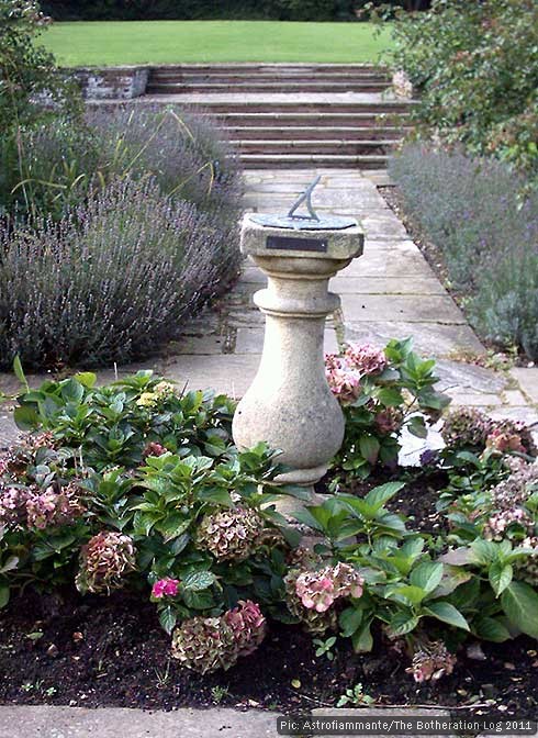 Sundial among hydrangeas