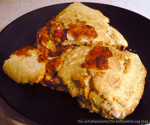 A slice of calzone on a plate