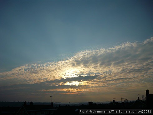 The same clouds illuminated by a setting sun