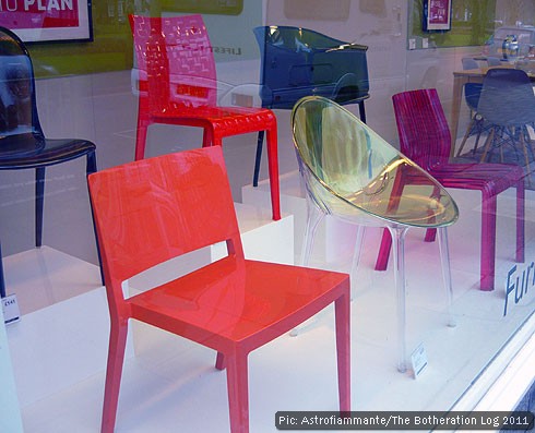 Plastic chairs in a department store window
