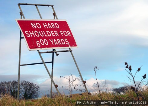 Red motorway sign indicating no hard shoulder for 600 yards