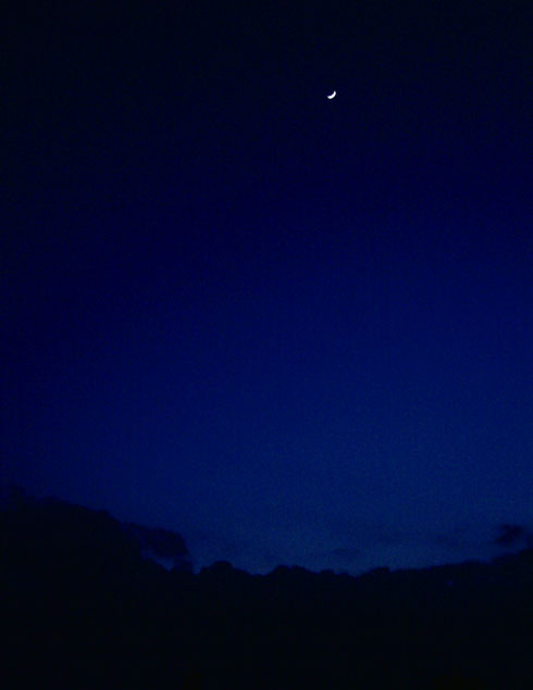 Crescent moon rising shortly after sunset