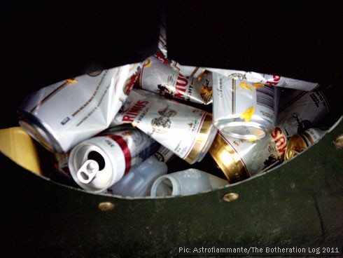 Beer cans in a recycling skip
