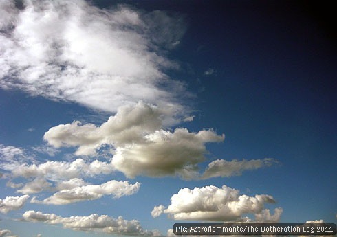 Cumulus and altocumulus clouds over farmland