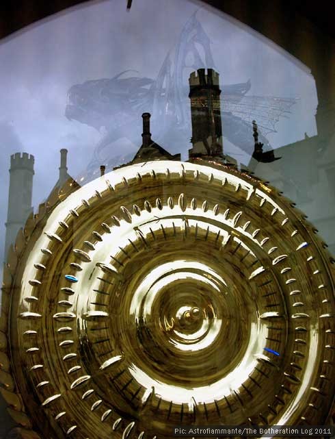 The Corpus Clock in Cambridge with reflected buildings