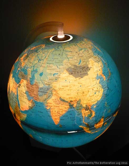Illuminated globe lamp in use, showing India and Asia