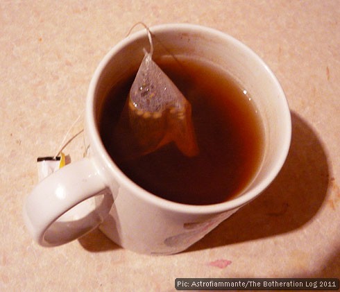 A mug of mint tea infusing